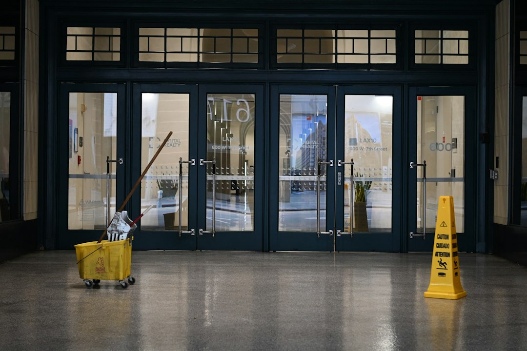 Wet floor caution sign and mopping